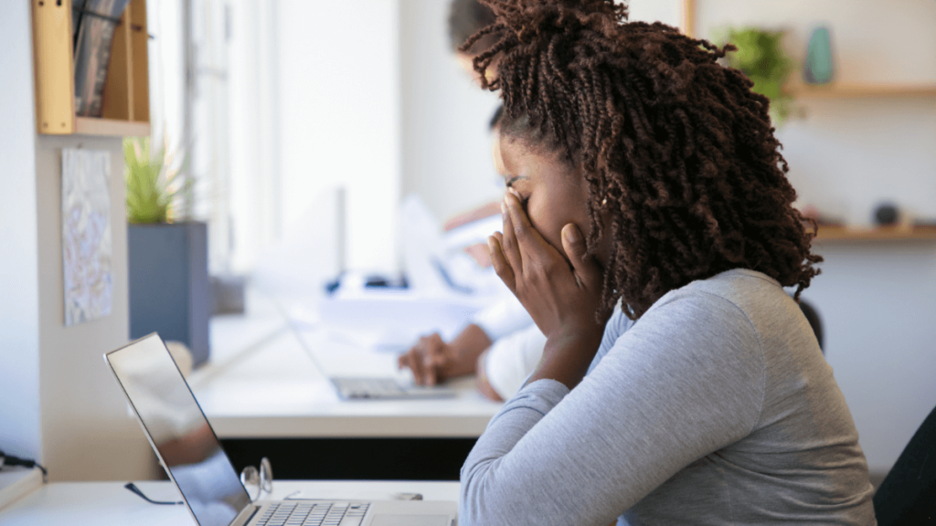 Student struggling with myNSFAS login on a laptop